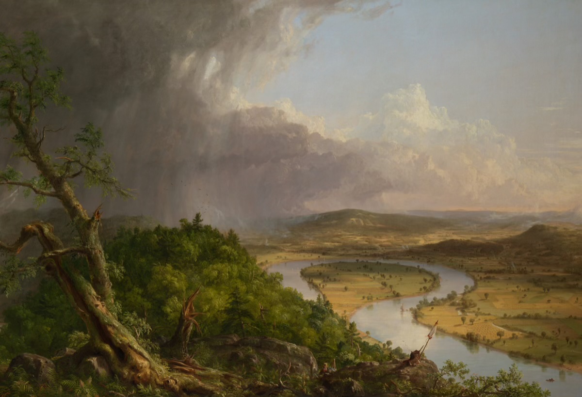 Sunlight breaking across a wide river valley in Thomas Cole's The Oxbow